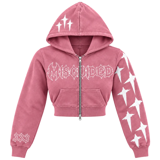 A pink cropped zip-up hoodie with white graphic prints, including the word 'MISGUIDED' across the chest, white starburst designs on the sleeves and hood, and '333' on the left sleeve cuff, shown against a plain white background.